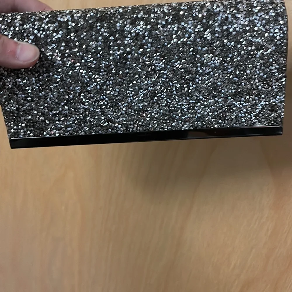 Saks Fifth Avenue sparkly gemstones clutch with chain link strap.